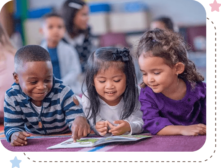 A group of children sitting at a table with books.