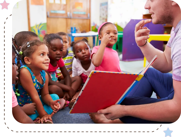 A group of children sitting in front of an adult.